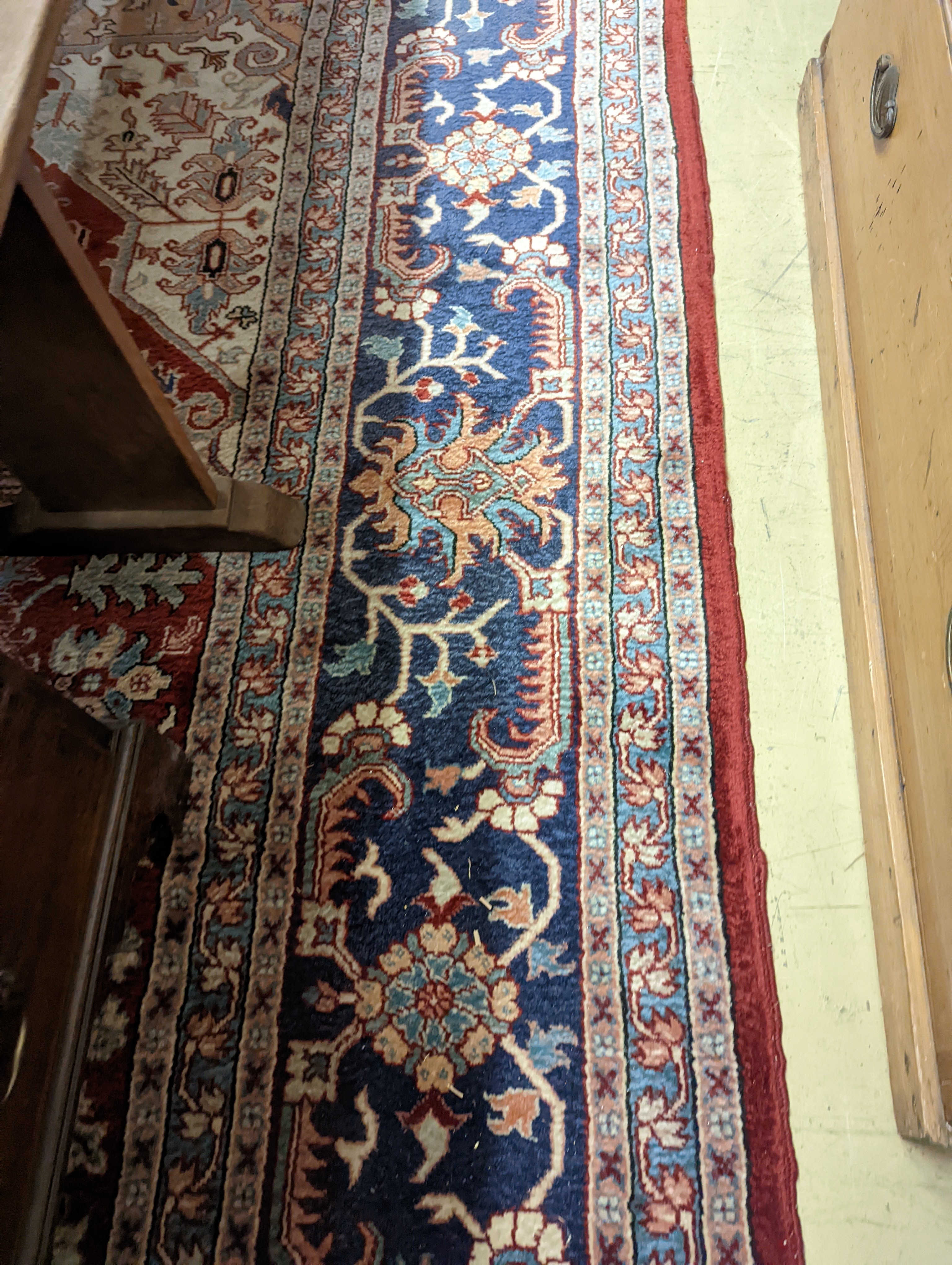 A large Caucasian style red ground carpet, 460 x 330cm